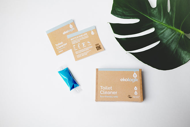 Box of concentrate toilet cleaner, a sachet of the blue powder sticky labels for bottle
