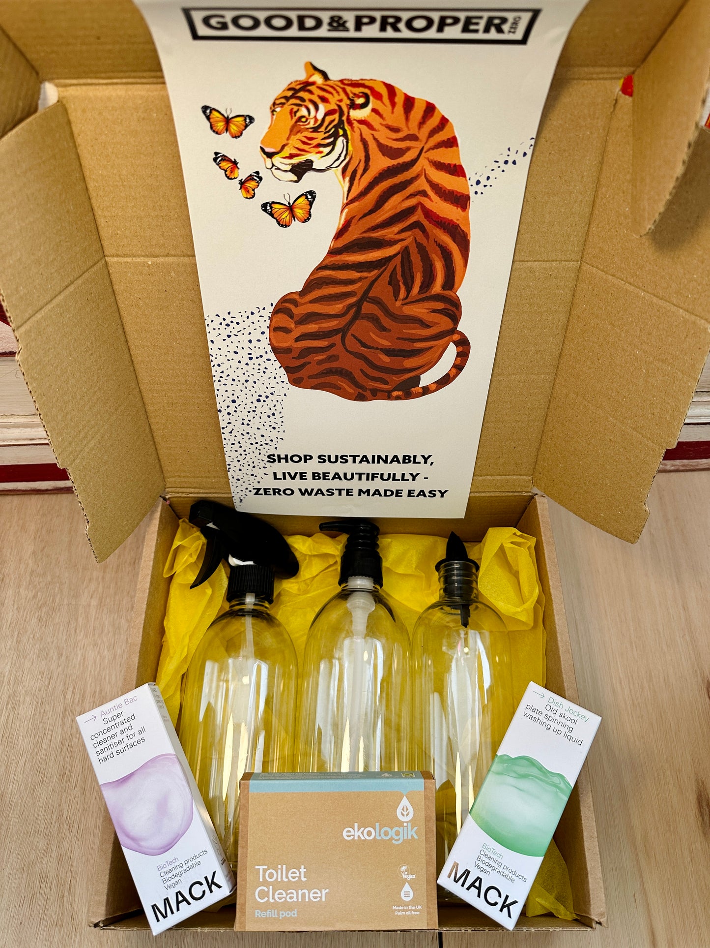 box with 3 refillable bottles next to 3 boxes of concentrate cleaning powders