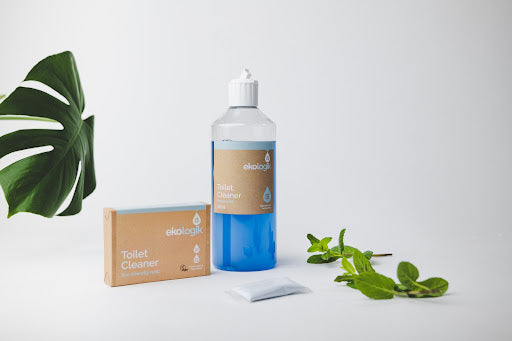 Bottle of blue toilet cleaner with concentrate sachet