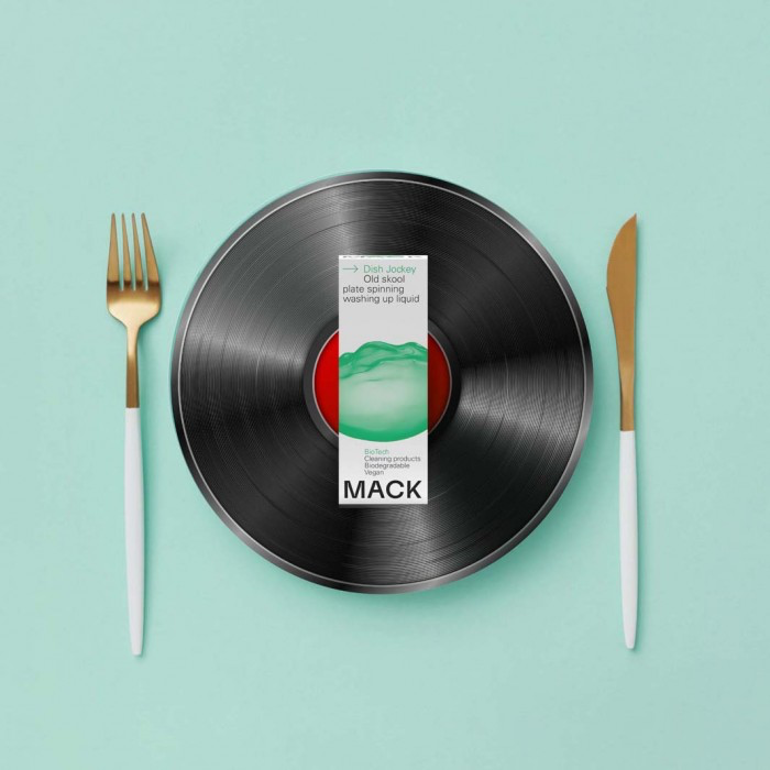 Mack washing-up liquid bio-pod on vinyl record with knife and fork either side,