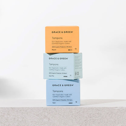 Image of 3 boxes of eco-friendly tampons made from sustainable materials, with a blue and orange packaging