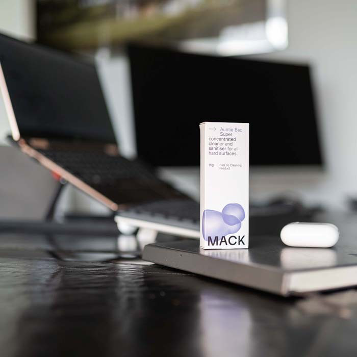 Box of concentrate Mack bio-pod sanitiser sat on desk with laptop