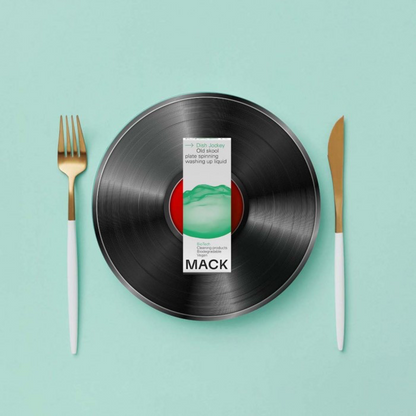 Mack washing-up liquid bio-pod on vinyl record with knife and fork either side, 